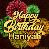 Golden text reading 'Happy Birthday Haniyah' surrounded by vibrant fireworks in red, green, and yellow, set against a dark background in this celebratory birthday GIF.
