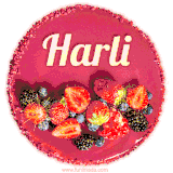 Beautifully decorated red velvet berry birthday cake with vibrant fruits and a glowing 'Harli' name, adding a touch of sweetness and sparkle.