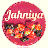 Beautifully decorated red velvet berry birthday cake with vibrant fruits and a glowing 'Jahniya' name, adding a touch of sweetness and sparkle.