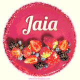 Beautifully decorated red velvet berry birthday cake with vibrant fruits and a glowing 'Jaia' name, adding a touch of sweetness and sparkle.