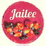Beautifully decorated red velvet berry birthday cake with vibrant fruits and a glowing 'Jailee' name, adding a touch of sweetness and sparkle.