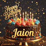 A decorated birthday cake with colorful frosting rosettes, glowing candles, and a golden Happy Birthday topper with the name Jaion.