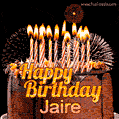 A rich chocolate cake topped with glowing birthday candles and surrounded by bright fireworks. The animated GIF displays the message 'Happy Birthday Jaire' in golden text.