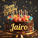 Golden lettering spelling Jairo on a rich chocolate birthday cake decorated with rainbow sprinkles.