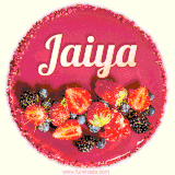 Beautifully decorated red velvet berry birthday cake with vibrant fruits and a glowing 'Jaiya' name, adding a touch of sweetness and sparkle.