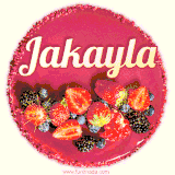 Beautifully decorated red velvet berry birthday cake with vibrant fruits and a glowing 'Jakayla' name, adding a touch of sweetness and sparkle.