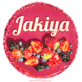 Beautifully decorated red velvet berry birthday cake with vibrant fruits and a glowing 'Jakiya' name, adding a touch of sweetness and sparkle.