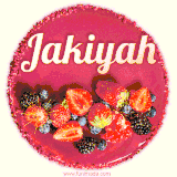 Beautifully decorated red velvet berry birthday cake with vibrant fruits and a glowing 'Jakiyah' name, adding a touch of sweetness and sparkle.