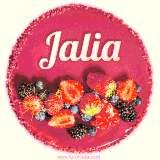 Beautifully decorated red velvet berry birthday cake with vibrant fruits and a glowing 'Jalia' name, adding a touch of sweetness and sparkle.