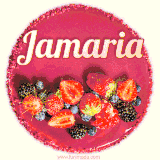 Beautifully decorated red velvet berry birthday cake with vibrant fruits and a glowing 'Jamaria' name, adding a touch of sweetness and sparkle.