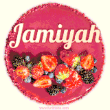 Beautifully decorated red velvet berry birthday cake with vibrant fruits and a glowing 'Jamiyah' name, adding a touch of sweetness and sparkle.