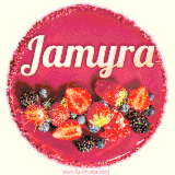 Beautifully decorated red velvet berry birthday cake with vibrant fruits and a glowing 'Jamyra' name, adding a touch of sweetness and sparkle.