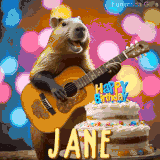 Animated birthday GIF showing a capybara playing guitar and singing beside a birthday cake with the name Jane in large letters and colorful bokeh lights in the background.