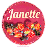 Beautifully decorated red velvet berry birthday cake with vibrant fruits and a glowing 'Janette' name, adding a touch of sweetness and sparkle.