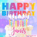A vibrant animated name GIF with the words 'Happy Birthday Janis' with colorful candles on a creamy cake. The background sparkles with pastel shades, adding a festive touch.