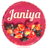 Beautifully decorated red velvet berry birthday cake with vibrant fruits and a glowing 'Janiya' name, adding a touch of sweetness and sparkle.