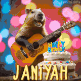 Animated birthday GIF showing a capybara playing guitar and singing beside a birthday cake with the name Janiyah in large letters and colorful bokeh lights in the background.