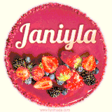 Beautifully decorated red velvet berry birthday cake with vibrant fruits and a glowing 'Janiyla' name, adding a touch of sweetness and sparkle.