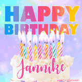 A vibrant animated name GIF with the words 'Happy Birthday Jannike' with colorful candles on a creamy cake. The background sparkles with pastel shades, adding a festive touch.