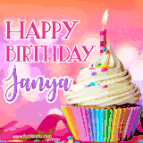 A vibrant birthday GIF featuring a rainbow-colored cupcake topped with white frosting, sprinkles, and a lit candle. The text reads 'Happy Birthday Janya' in bold pink and violet letters with white outline.
