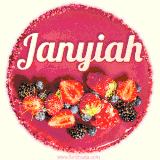 Beautifully decorated red velvet berry birthday cake with vibrant fruits and a glowing 'Janyiah' name, adding a touch of sweetness and sparkle.