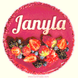 Beautifully decorated red velvet berry birthday cake with vibrant fruits and a glowing 'Janyla' name, adding a touch of sweetness and sparkle.