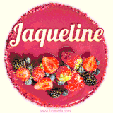 Beautifully decorated red velvet berry birthday cake with vibrant fruits and a glowing 'Jaqueline' name, adding a touch of sweetness and sparkle.