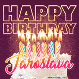 A colorful birthday cake topped with lit candles, with the words 'Happy Birthday Jaroslava' in bold glowing letters on a burgundy background. Animated flames add a festive touch.