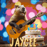Animated birthday GIF showing a capybara playing guitar and singing beside a birthday cake with the name Jaycee in large letters and colorful bokeh lights in the background.