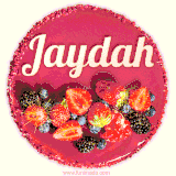 Beautifully decorated red velvet berry birthday cake with vibrant fruits and a glowing 'Jaydah' name, adding a touch of sweetness and sparkle.