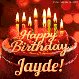 Beautifully decorated red velvet berry birthday cake with vibrant fruits and a glowing 'Jayde' name, adding a touch of sweetness and sparkle.