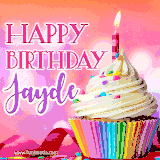 A vibrant birthday GIF featuring a rainbow-colored cupcake topped with white frosting, sprinkles, and a lit candle. The text reads 'Happy Birthday Jayde' in bold pink and violet letters with white outline.