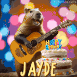 Animated birthday GIF showing a capybara playing guitar and singing beside a birthday cake with the name Jayde in large letters and colorful bokeh lights in the background.