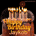 A rich chocolate cake topped with glowing birthday candles and surrounded by bright fireworks. The animated GIF displays the message 'Happy Birthday Jaykob' in golden text.