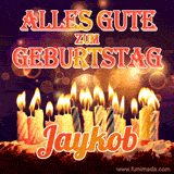 An animated GIF featuring 'Alles Gute Zum Geburtstag Jaykob' in glowing red and gold letters above a cake with colorful lit candles, set against a festive sparkling background.