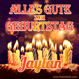 An animated GIF featuring 'Alles Gute Zum Geburtstag Jaylan' in glowing red and gold letters above a cake with colorful lit candles, set against a festive sparkling background.