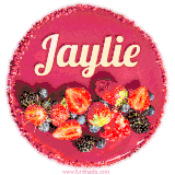 Beautifully decorated red velvet berry birthday cake with vibrant fruits and a glowing 'Jaylie' name, adding a touch of sweetness and sparkle.