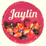 Beautifully decorated red velvet berry birthday cake with vibrant fruits and a glowing 'Jaylin' name, adding a touch of sweetness and sparkle.