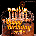 A rich chocolate cake topped with glowing birthday candles and surrounded by bright fireworks. The animated GIF displays the message 'Happy Birthday Jaylin' in golden text.
