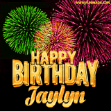 A captivating GIF with bursts of green, pink, and orange fireworks lighting up the night sky, accompanied by 'Happy Birthday Jaylyn' in glowing golden text.