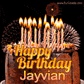 A rich chocolate cake topped with glowing birthday candles and surrounded by bright fireworks. The animated GIF displays the message 'Happy Birthday Jayvian' in golden text.