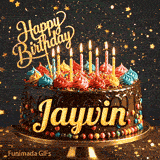 Multi-colored dollops of frosting and burning birthday candles on a chocolate glaze cake, custom-designed for Jayvin.