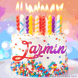 A cheerful white birthday cake with multicolor sprinkles, lit candles, and 'Jazmin' written in vibrant letters, in an animated GIF.