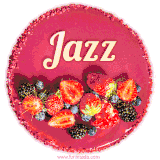 Beautifully decorated red velvet berry birthday cake with vibrant fruits and a glowing 'Jazz' name, adding a touch of sweetness and sparkle.