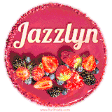 Beautifully decorated red velvet berry birthday cake with vibrant fruits and a glowing 'Jazzlyn' name, adding a touch of sweetness and sparkle.