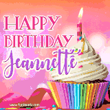 A vibrant birthday GIF featuring a rainbow-colored cupcake topped with white frosting, sprinkles, and a lit candle. The text reads 'Happy Birthday Jeannette' in bold pink and violet letters with white outline.