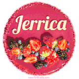 Beautifully decorated red velvet berry birthday cake with vibrant fruits and a glowing 'Jerrica' name, adding a touch of sweetness and sparkle.