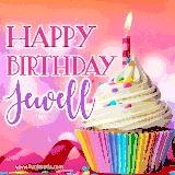 A vibrant birthday GIF featuring a rainbow-colored cupcake topped with white frosting, sprinkles, and a lit candle. The text reads 'Happy Birthday Jewell' in bold pink and violet letters with white outline.