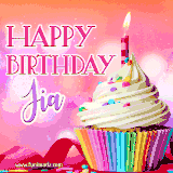 A vibrant birthday GIF featuring a rainbow-colored cupcake topped with white frosting, sprinkles, and a lit candle. The text reads 'Happy Birthday Jia' in bold pink and violet letters with white outline.