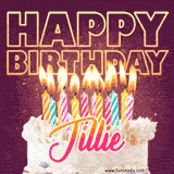 A colorful birthday cake topped with lit candles, with the words 'Happy Birthday Jillie' in bold glowing letters on a burgundy background. Animated flames add a festive touch.